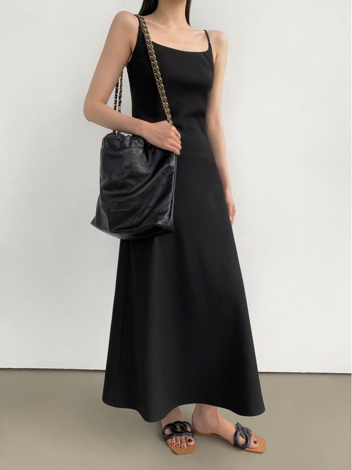 Black French suspender dress for women's new minimalist style diagonal cut long skirt 